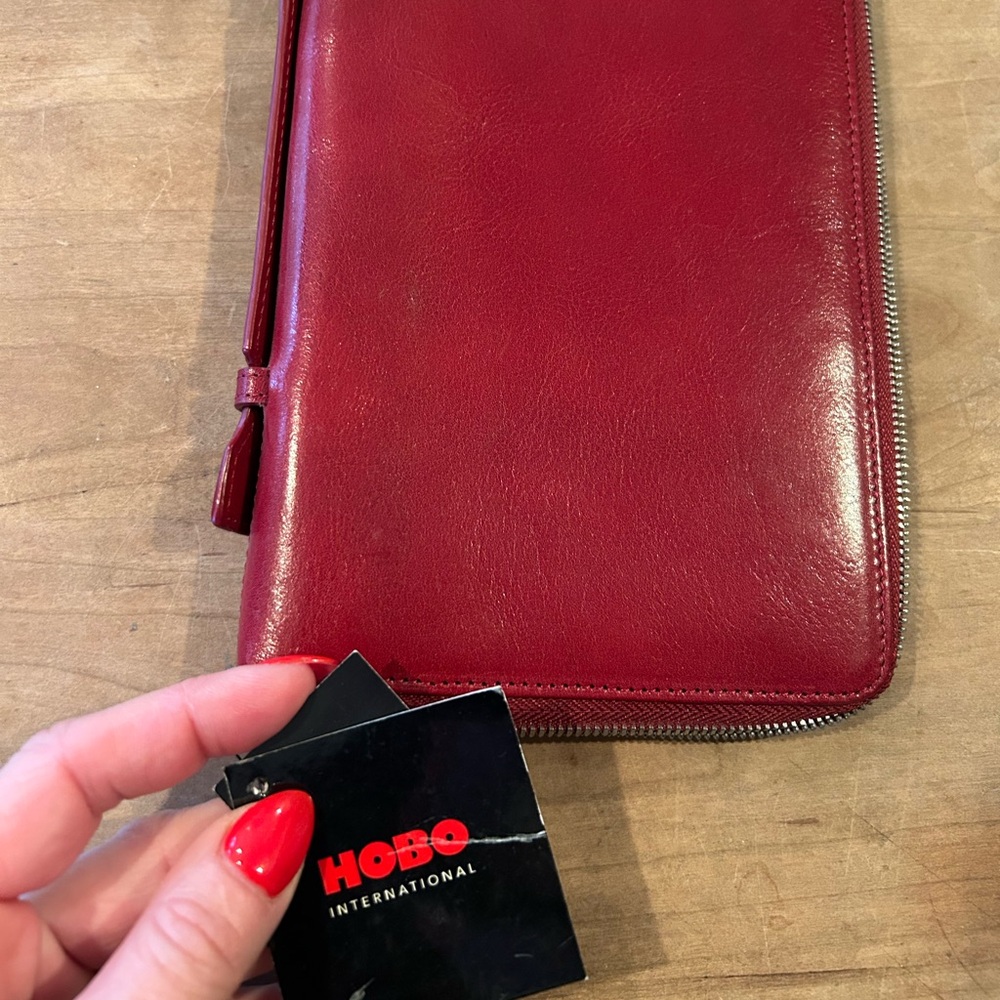 Dark red brand new with tags Hobo wallet.